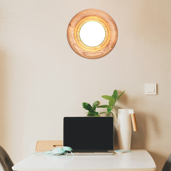 Orbitus Wandlamp – Ronde rust in hout en licht