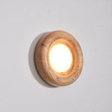 Orbitus Wandlamp – Ronde rust in hout en licht