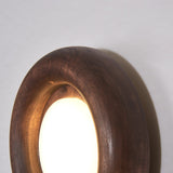 Orbitus Wandlamp – Ronde rust in hout en licht
