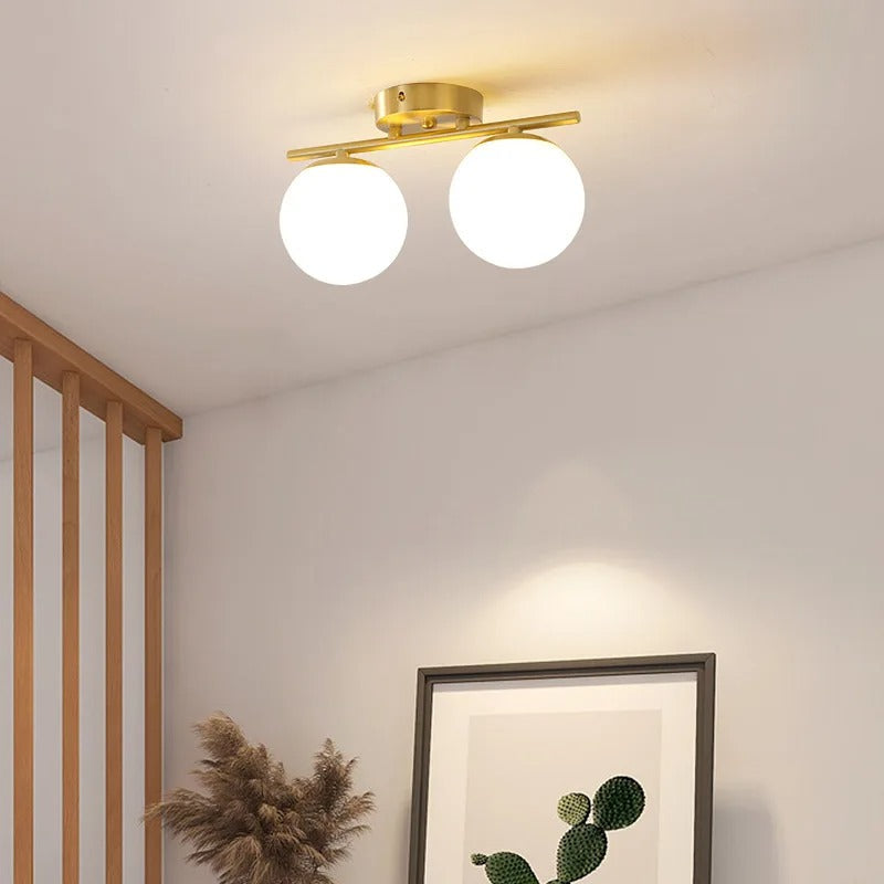 LumeSphere – LED Plafondlamp in glas met gouden accenten